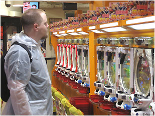 nick in a pachinko parlor with his cool clear plastic poncho jacket