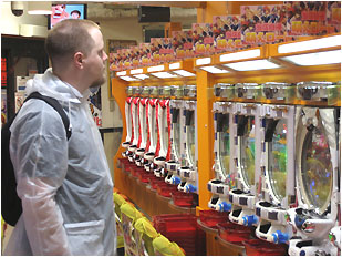 nick in a pachinko parlor with his cool clear plastic poncho jacket