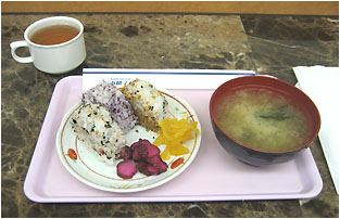 traditional breakfast of rice balls, miso, and hot tea