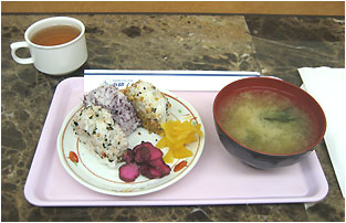 traditional breakfast of rice balls, miso, and hot tea