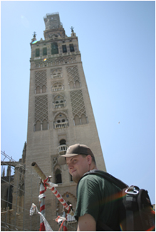 nick in front of the giralda of the gothic cathedral of sevilla